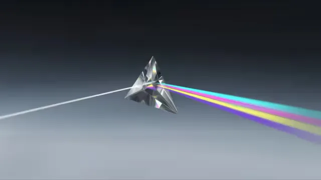 A glass prism splitting a beam of light into a colour spectrum